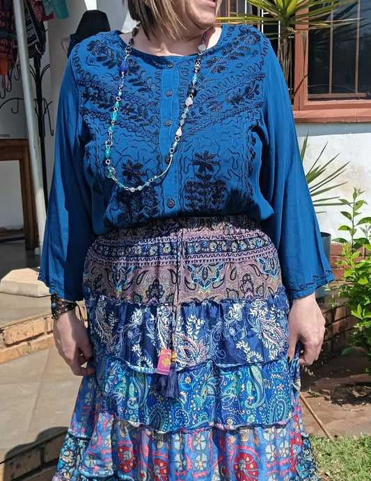 Embroidered Viscose Long Sleeve Blouse in Teal – full front view showing dense black embroidery and ruffle button placket