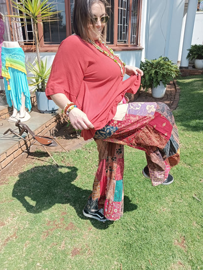 Patchwork Bell Bottom Pants - lifting top to show waistband and pockets