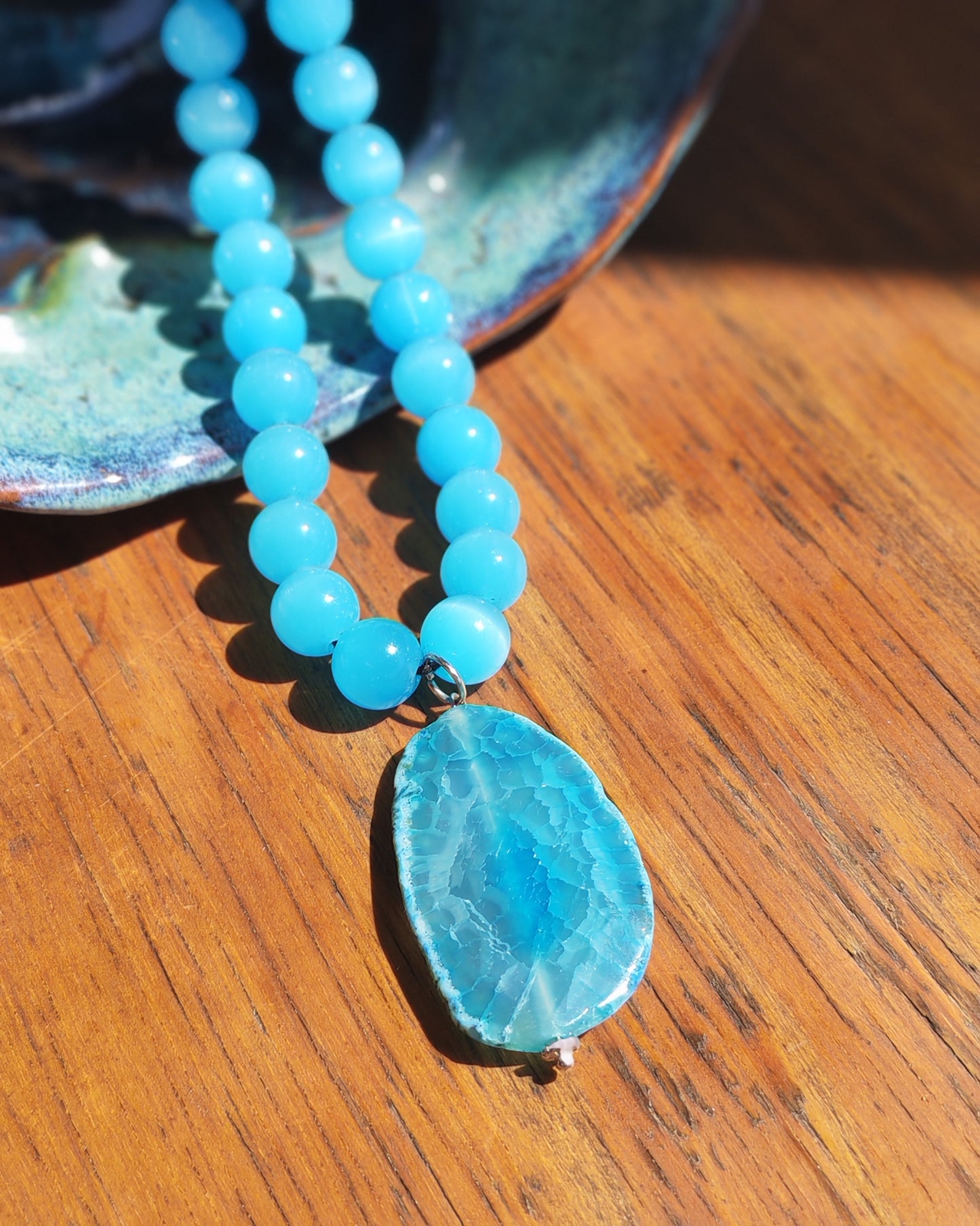 Blue Agate Druzy Slice Pendant on Sky Blue Glass Bead Necklace