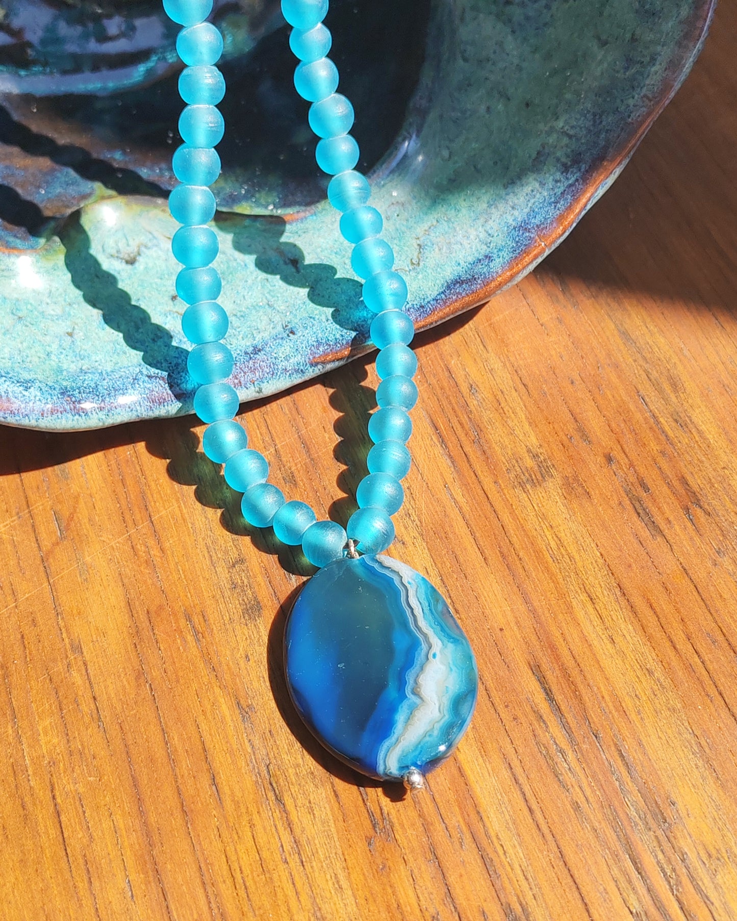 Blue Agate Oval Pendant on Frosted Blue Glass Bead Necklace