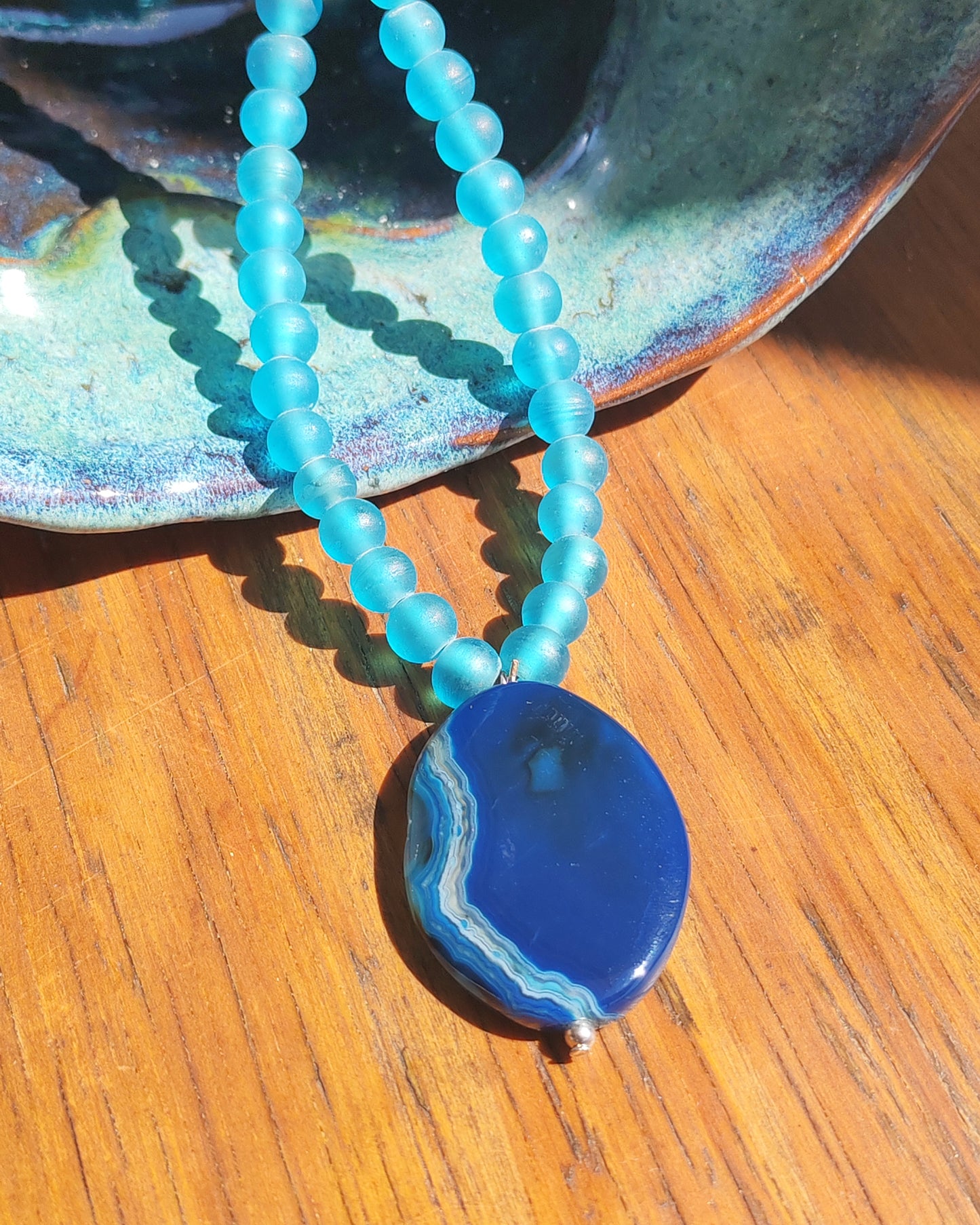 Blue Agate Oval Pendant on Frosted Blue Glass Bead Necklace
