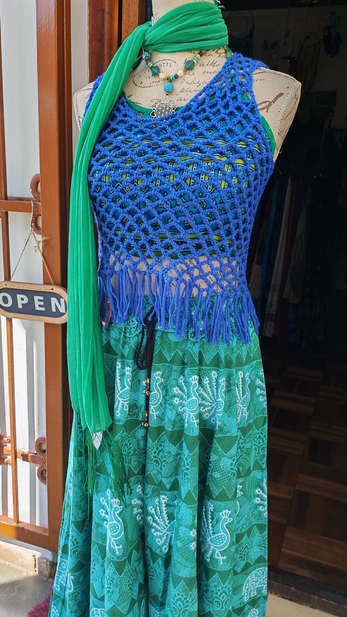 Cobalt Blue Crochet Fringe Tank Top — full length on mannequin with teal skirt and green scarf