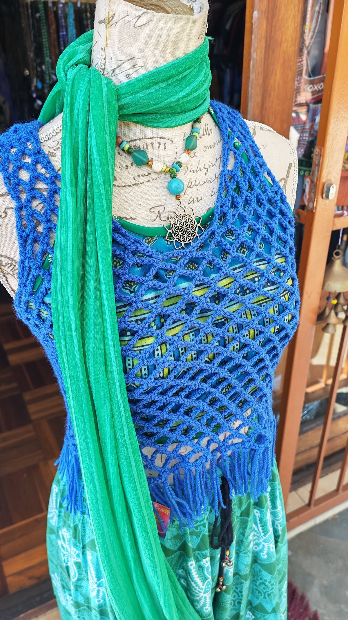 Cobalt Blue Crochet Fringe Tank Top — side view on mannequin showing mesh weave and fringe