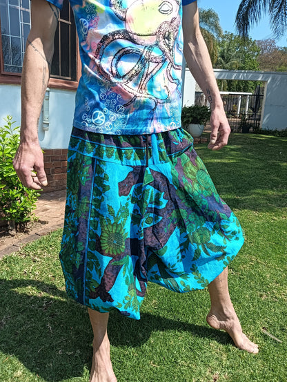 Tropical Print Aladdin Harem Pants in Teal Blue — side view showing balloon silhouette