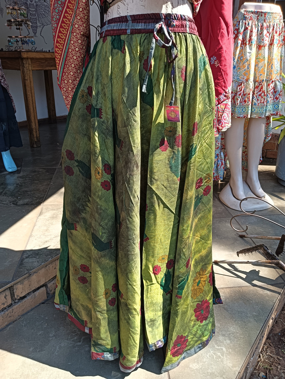Overdyed Sari Silk Maxi Skirt – side view with red wrap top showing full skirt volume and length