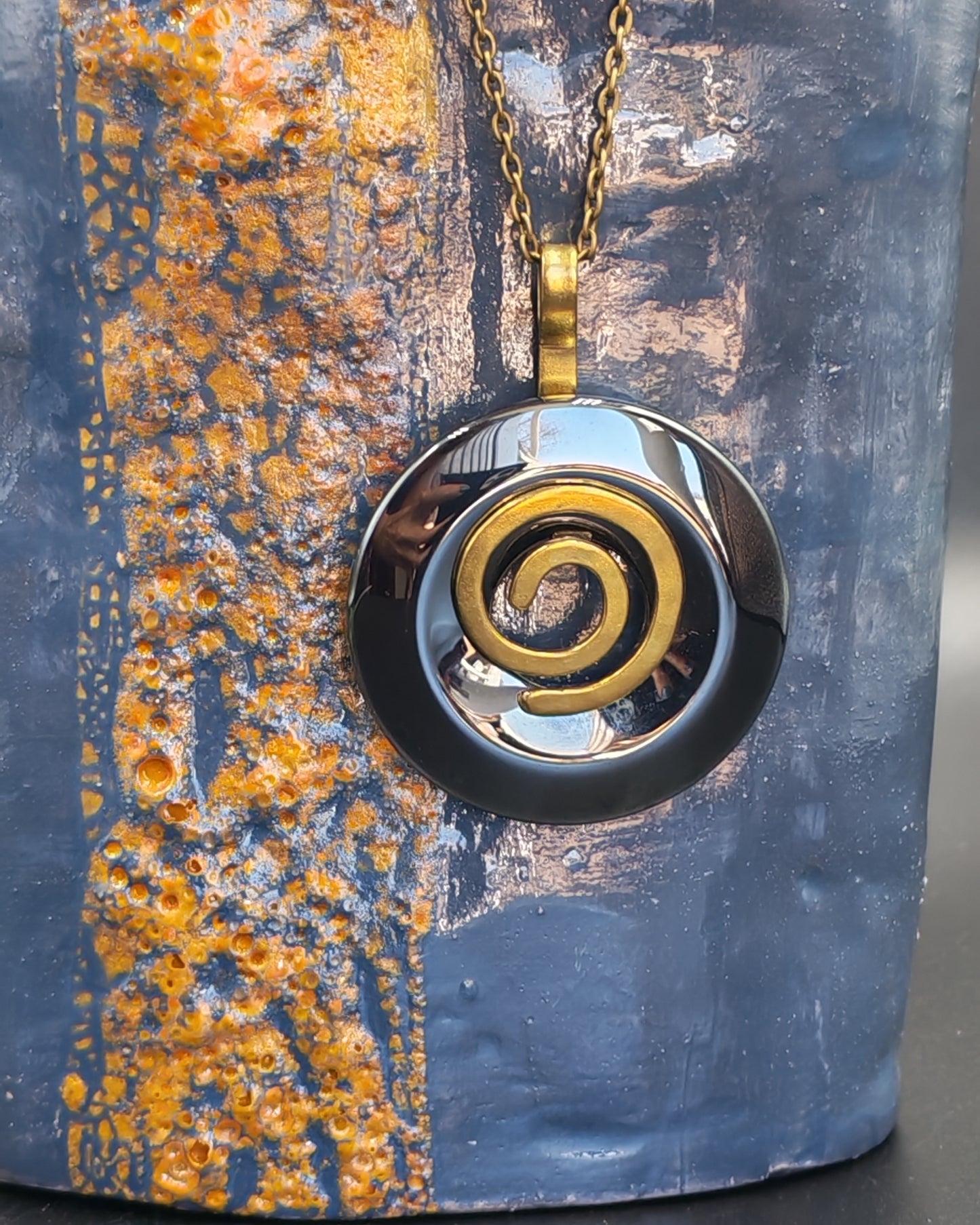Natural Hematite Donut Pendant with Copper Spiral Setting