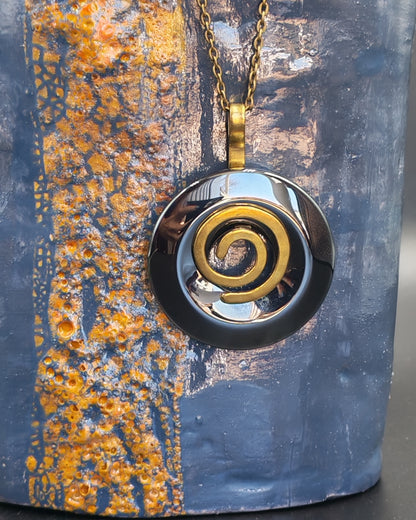 Natural Hematite Donut Pendant with Copper Spiral Setting