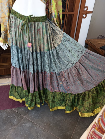 Iridescent Sari Silk Tiered Maxi Skirt – close-up of tiered panels showing sage, dusty blue, mauve and forest green with gold hem border