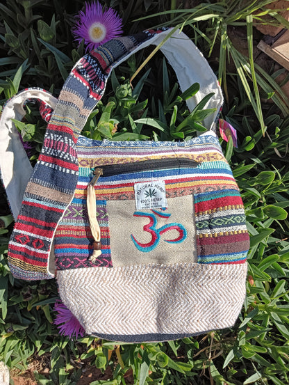 Himalayan Hemp Om Sling Bag – blue Om embroidery colourway, tapestry stripe panels and herringbone hemp base
