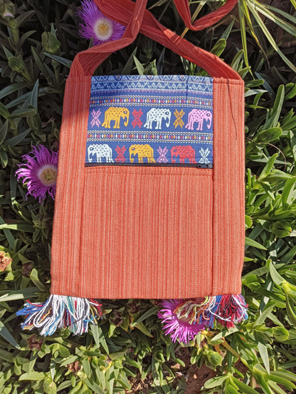 Thai Woven Cotton Sling Bag Terracotta and Blue Elephant – back view showing elephant parade panel and zip pocket