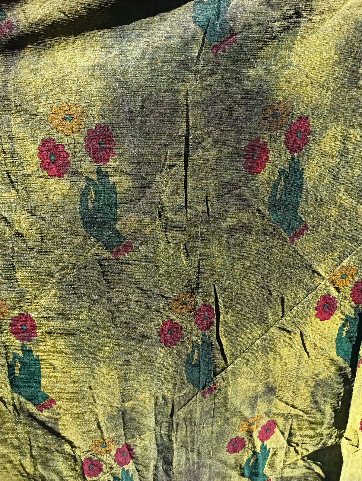 Overdyed Sari Silk Maxi Skirt – close-up of hand-and-flower print detail showing teal hands with red and yellow blooms