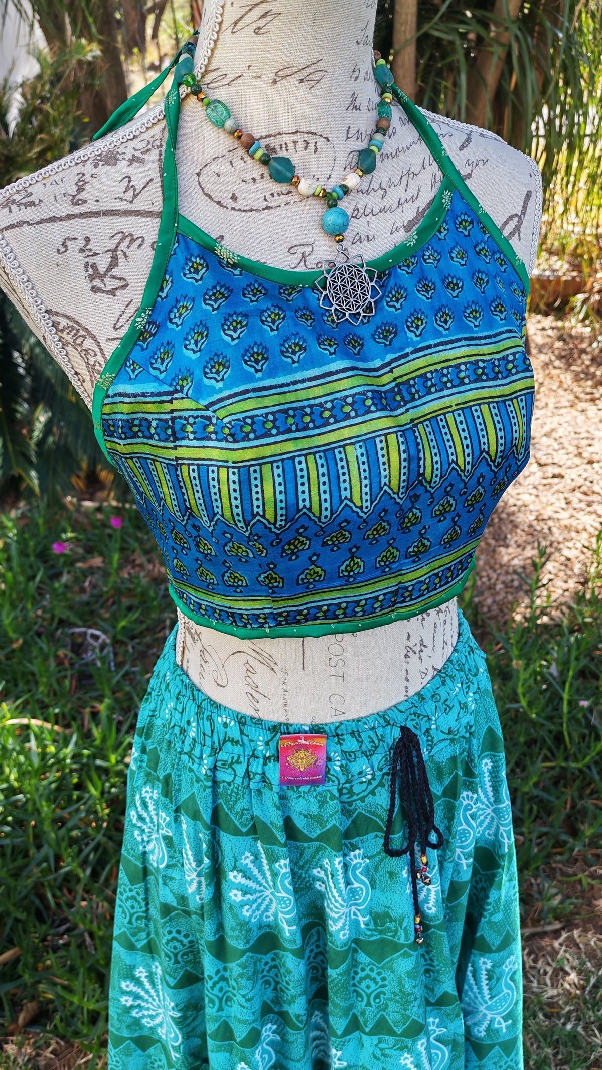 Reversible Satin Halter Crop Top – emerald green side showing diamond dot print detail