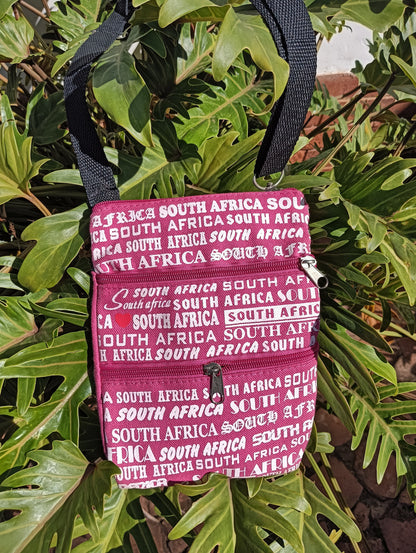 South Africa Print Canvas Bag in Berry Pink — front view showing all-over text print and double zip pockets
