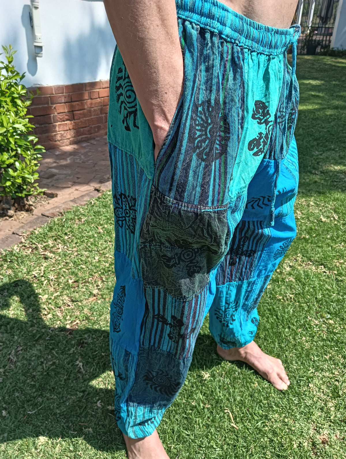 Stonewashed Patchwork Harem Pants in Turquoise – close-up of waistband, pocket and stamp motif patchwork detail