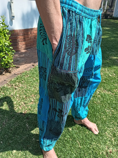 Stonewashed Patchwork Harem Pants in Turquoise – close-up of waistband, pocket and stamp motif patchwork detail
