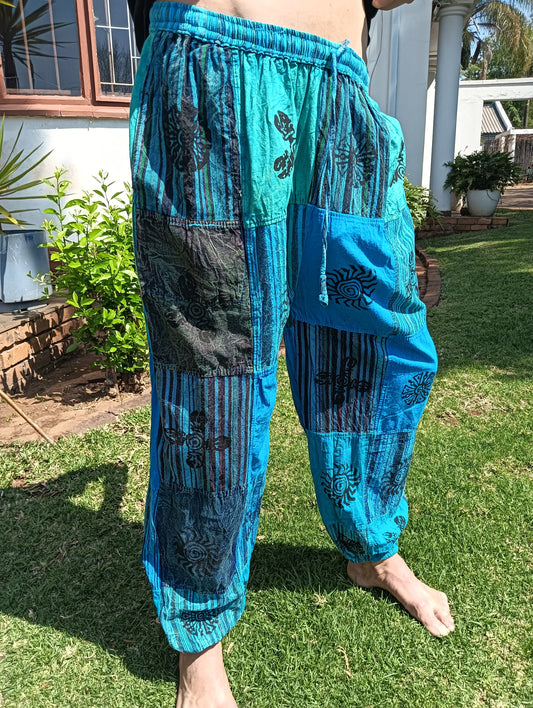 Stonewashed Patchwork Harem Pants in Turquoise – full length front view showing patchwork panels and tapered cuffed ankle
