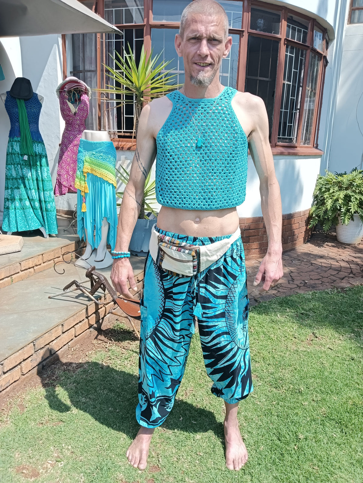 Cotton Crochet Racerback Crop Top — full length on male model outdoors with harem pants