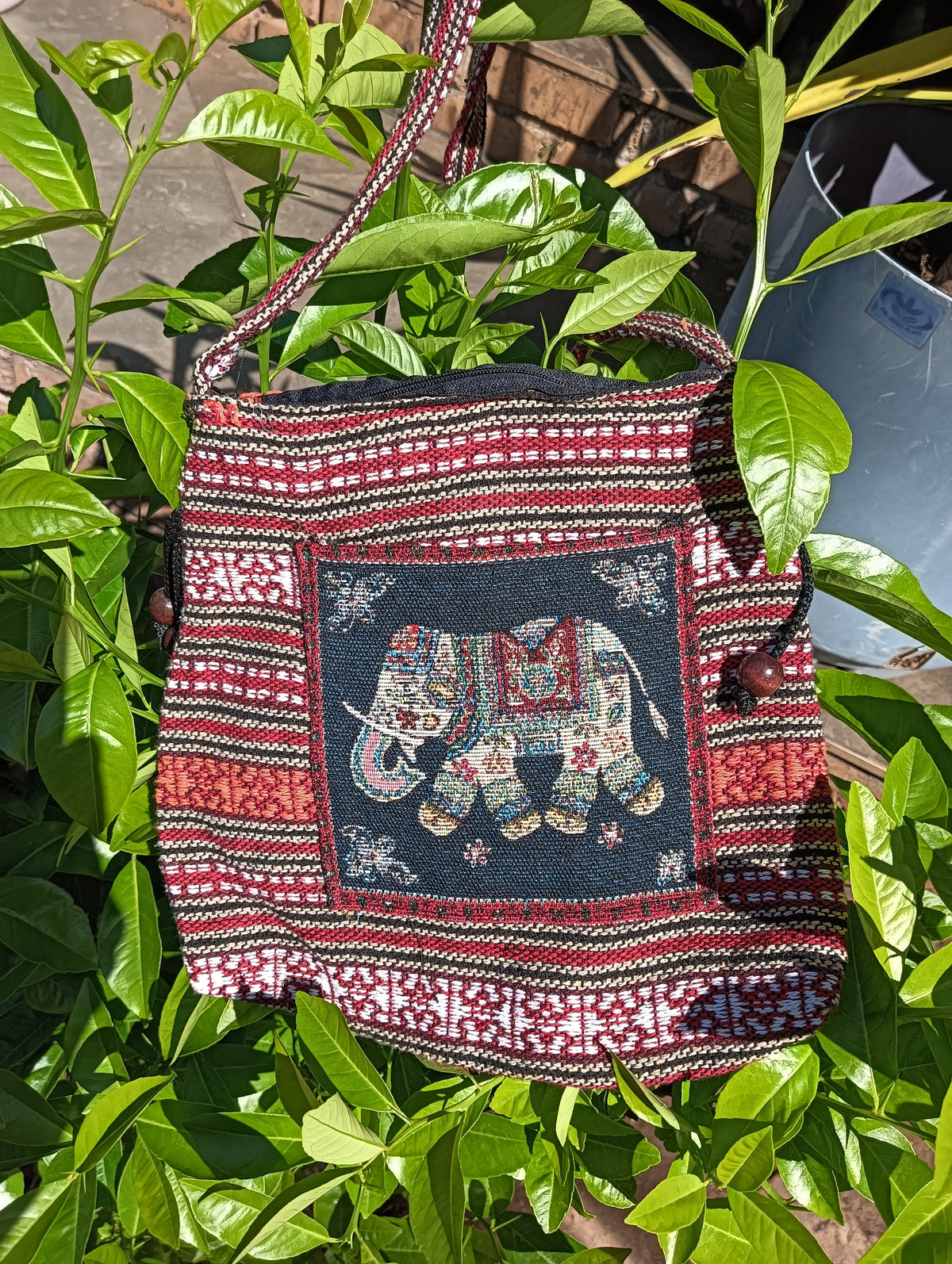 Thai Woven Sling Bag – Elephant Motif with Wood Beads — front view showing elephant panel, red stripe weave and wood bead detail