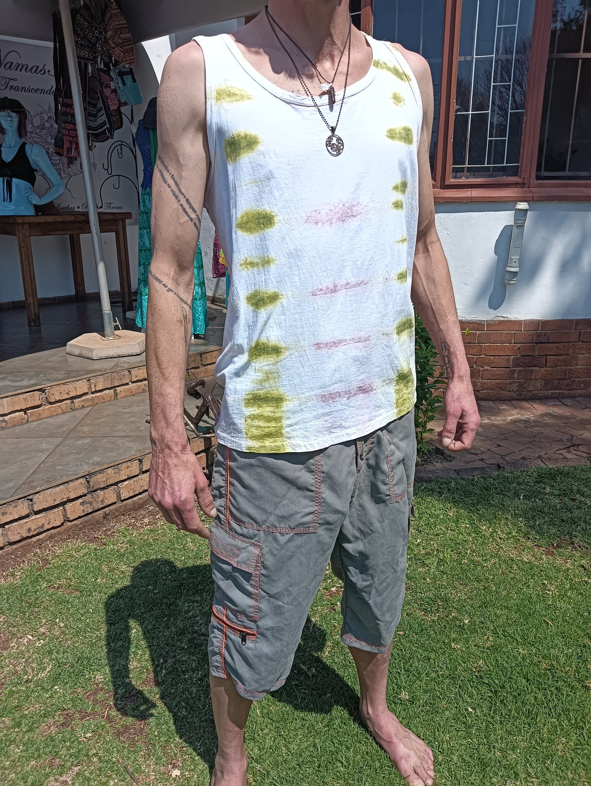 Hand Tie-Dye Vest in White Olive and Pink – front view on male model showing full vest and dye pattern