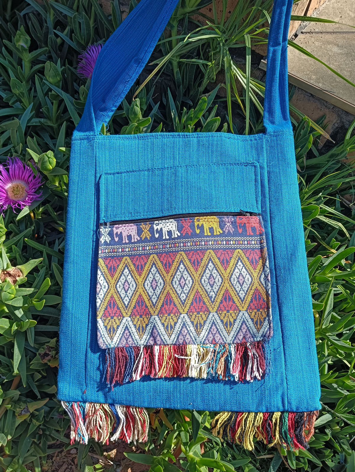 Thai Woven Sling Bag in Turquoise — front view showing diamond weave panel and elephant trim