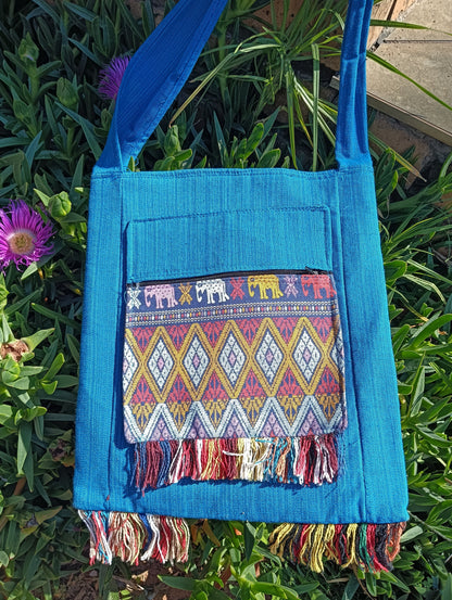 Thai Woven Sling Bag in Turquoise — front view showing diamond weave panel and elephant trim