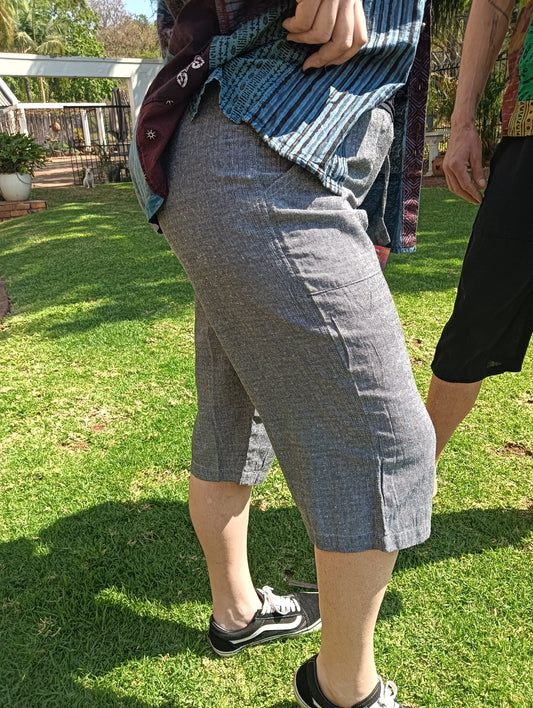 Nepali Long Shorts in Charcoal Grey — side view on model