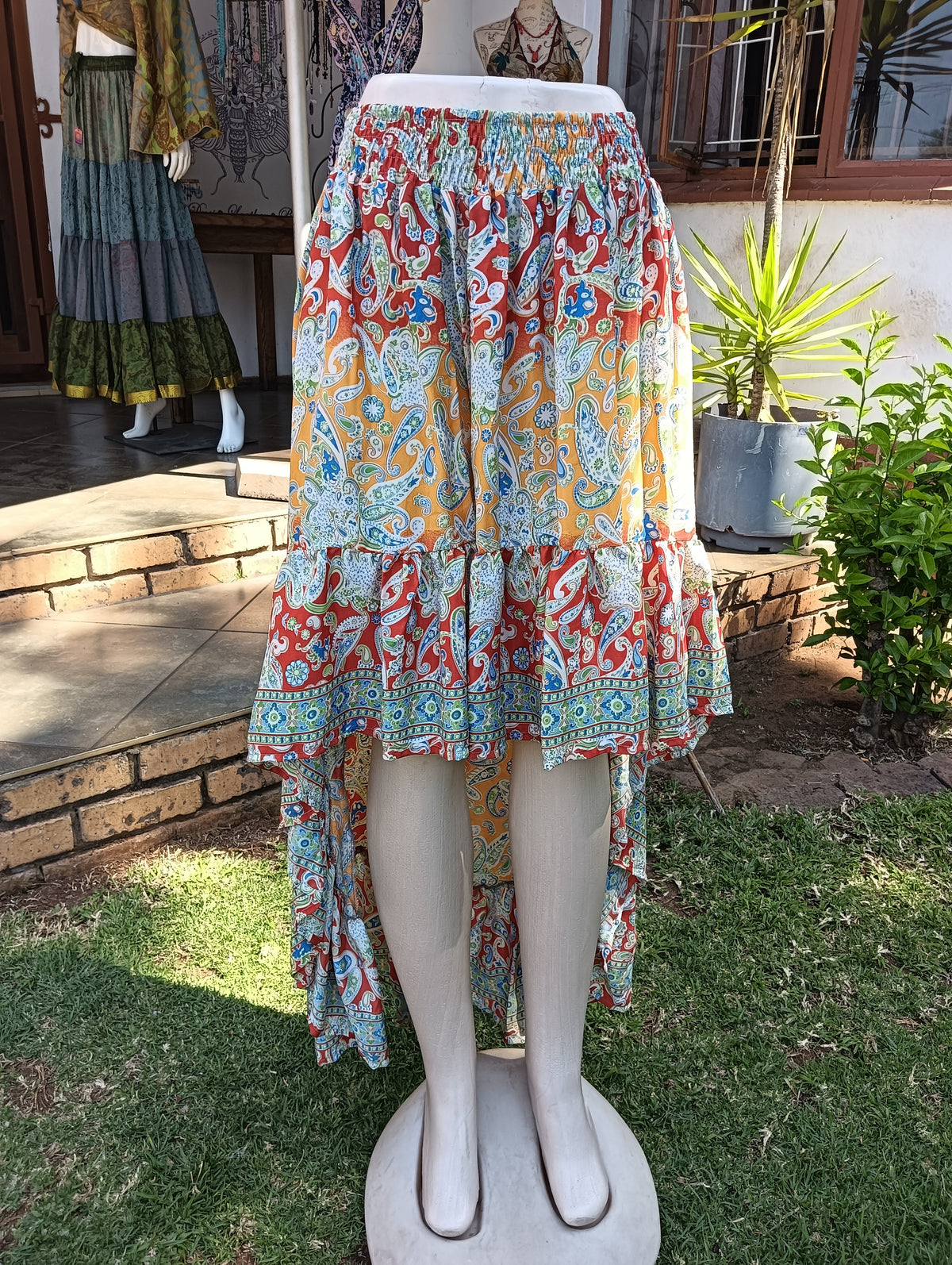Paisley Poly Silk Hi-Low Frill Skirt — back view showing longer hem and smocked waistband