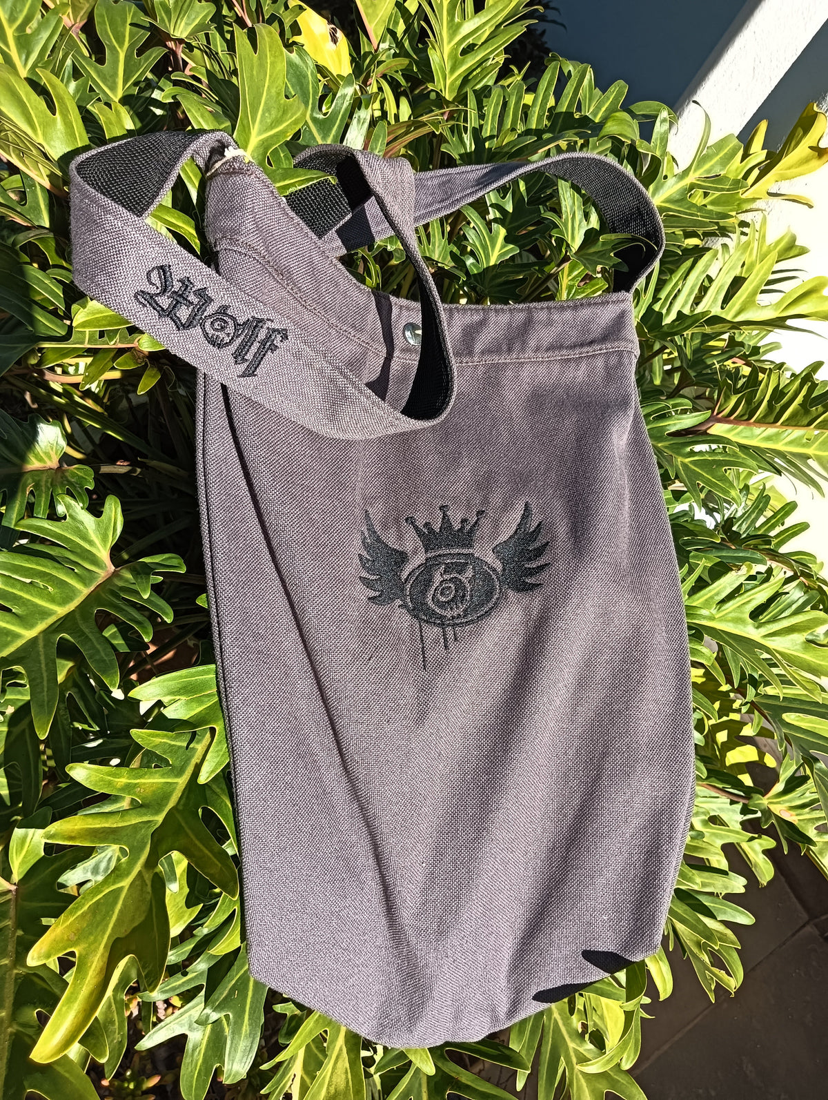 Wolf Canvas Sling Bag in grey with embroidered wolf crown crest