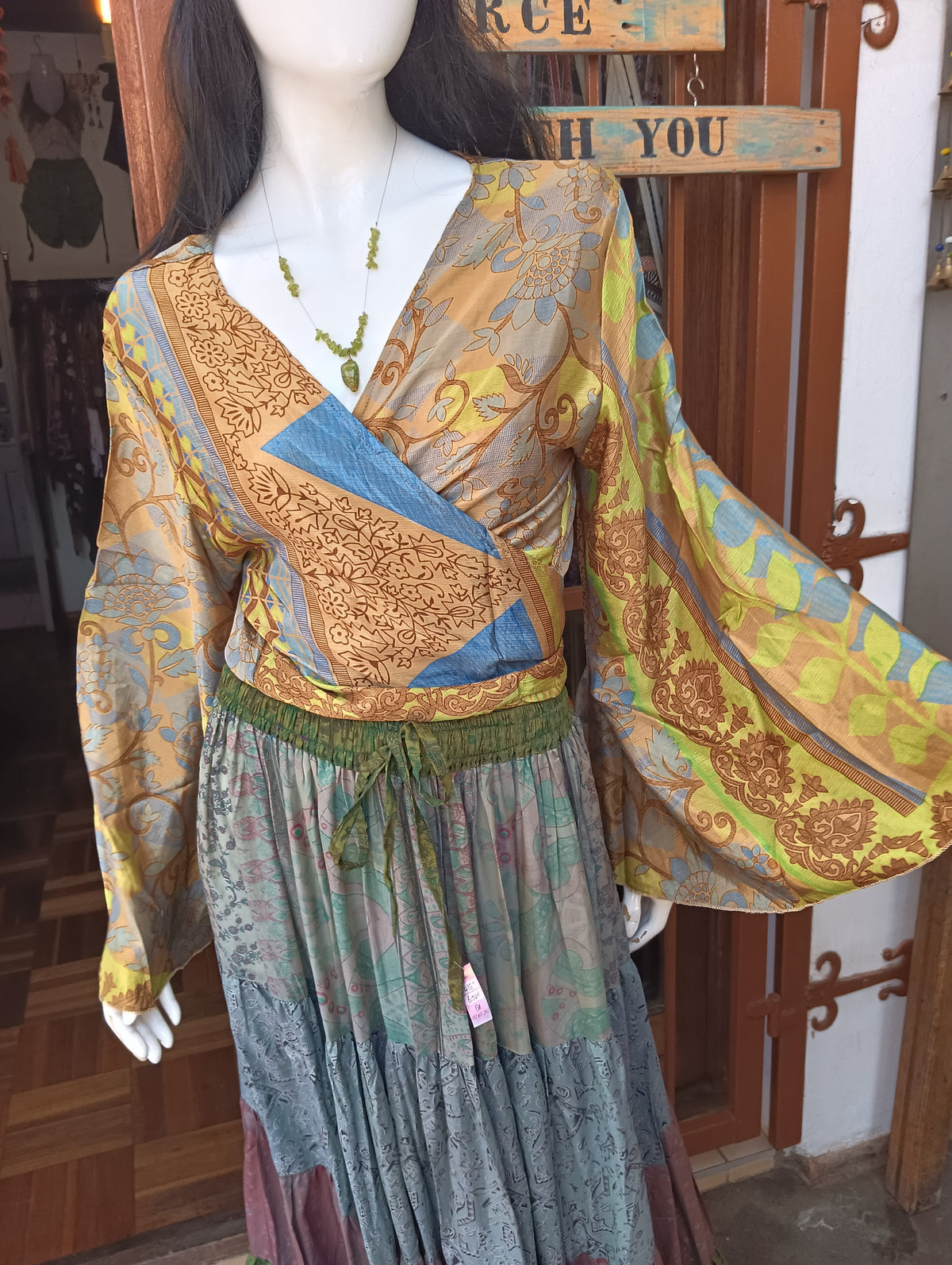 Sari Silk Wrap Crop Top – front knot style on mannequin showing copper gold teal patchwork panels and angel sleeves
